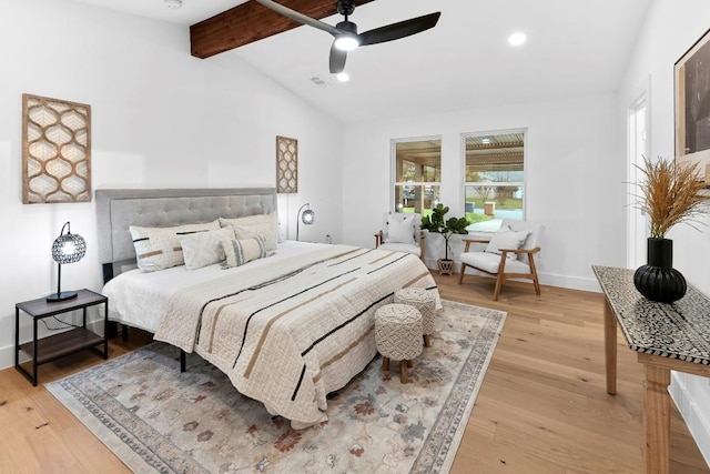 bedroom with light wood-type flooring, lofted ceiling with beams, and ceiling fan