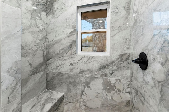 room details featuring a tile shower