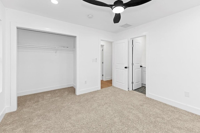 unfurnished bedroom featuring carpet flooring, ceiling fan, and a closet