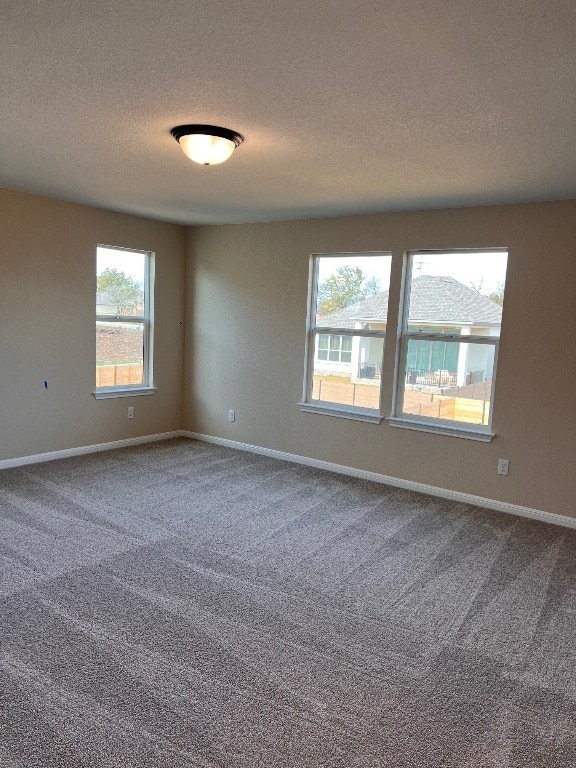 128 Alistair Dr, Georgetown, TX 78633 - carpeted spare room featuring a textured ceiling and baseboards