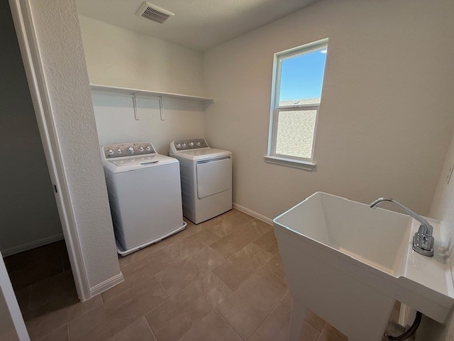 128 Alistair Dr, Georgetown, TX 78633 - laundry area with washing machine and dryer and baseboards