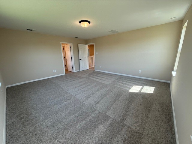 128 Alistair Dr, Georgetown, TX 78633 - unfurnished bedroom featuring baseboards and carpet floors