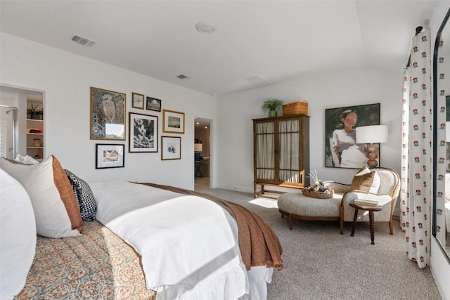 carpeted bedroom with vaulted ceiling