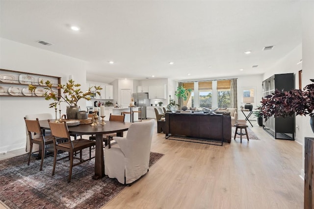 dining area with light hardwood / wood-style flooring