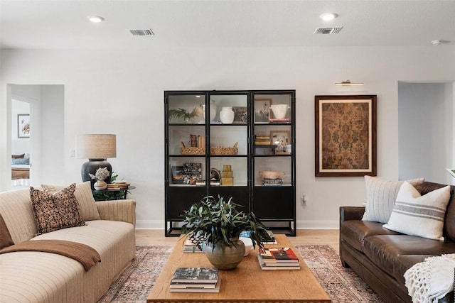 living room with light hardwood / wood-style floors