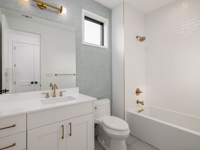 full bathroom featuring tile patterned flooring, vanity, toilet, and shower / bathtub combination