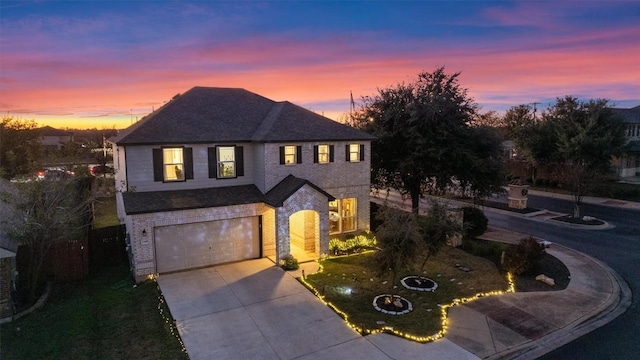 view of front facade featuring a yard and a garage