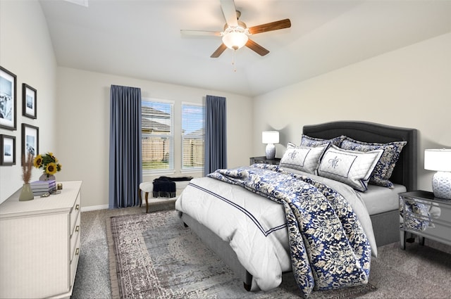 carpeted bedroom with ceiling fan and lofted ceiling