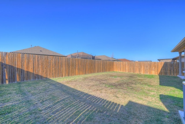 view of yard featuring a fenced backyard