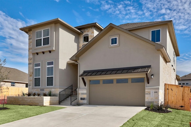 view of front of house featuring a garage and a front yard