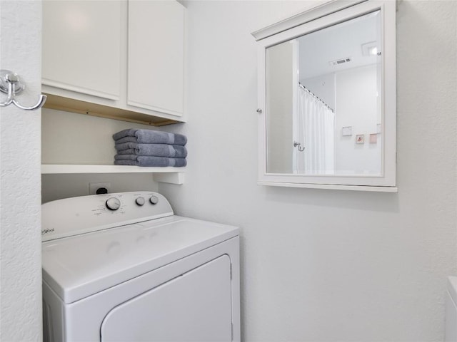 laundry room with cabinets and washer / clothes dryer