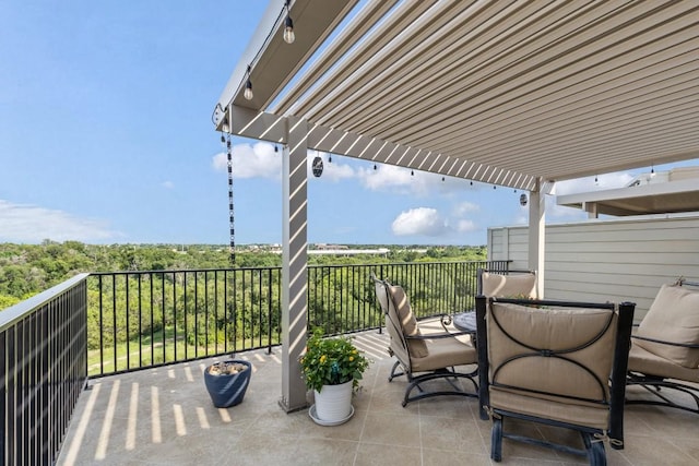 view of patio featuring a balcony