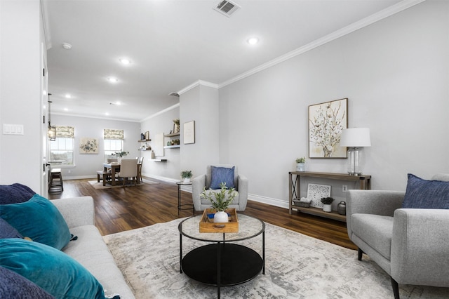 living room with dark hardwood / wood-style flooring and crown molding