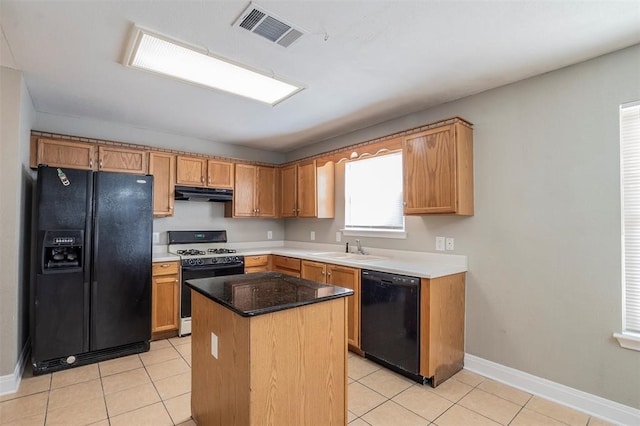 kitchen with black appliances, a center island, light tile patterned flooring, and sink