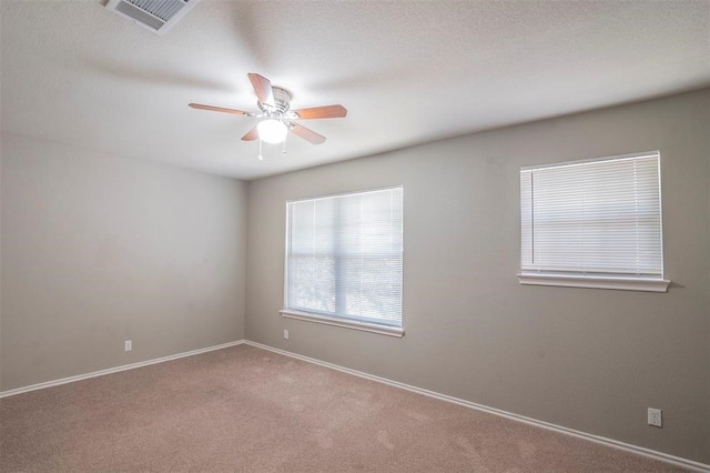 carpeted empty room with ceiling fan