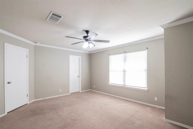 empty room with light carpet, crown molding, and ceiling fan