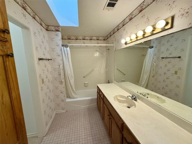 bathroom featuring tile patterned flooring, vanity, and shower / bathtub combination with curtain