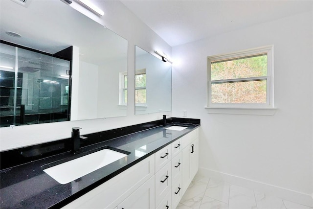 bathroom featuring vanity and a shower with shower door