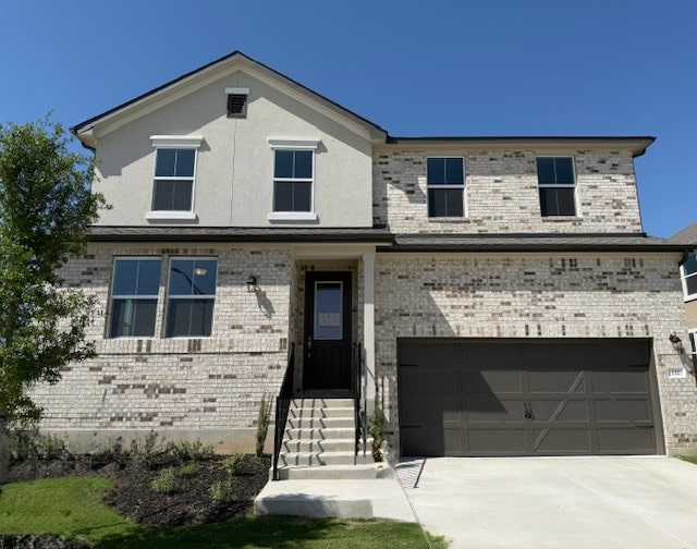 132 Alistair Dr, Georgetown, TX 78633 - view of front of home with a garage, brick siding, and concrete driveway