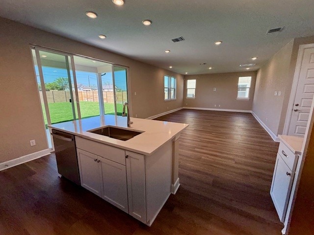 132 Alistair Dr, Georgetown, TX 78633 - kitchen featuring a sink, stainless steel dishwasher, dark wood-type flooring, baseboards, and recessed lighting