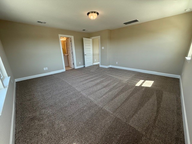 132 Alistair Dr, Georgetown, TX 78633 - unfurnished bedroom featuring baseboards and carpet