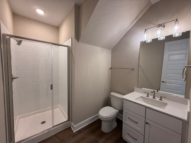 132 Alistair Dr, Georgetown, TX 78633 - full bath with a textured wall, wood finished floors, a stall shower, toilet, and vanity