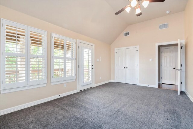 504 River Down Rd, Georgetown, TX 78628 - unfurnished bedroom with dark carpet, lofted ceiling, access to outside, and a ceiling fan