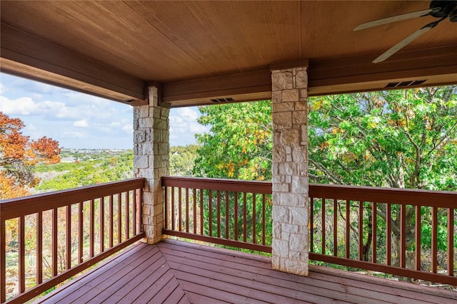 wooden terrace featuring ceiling fan