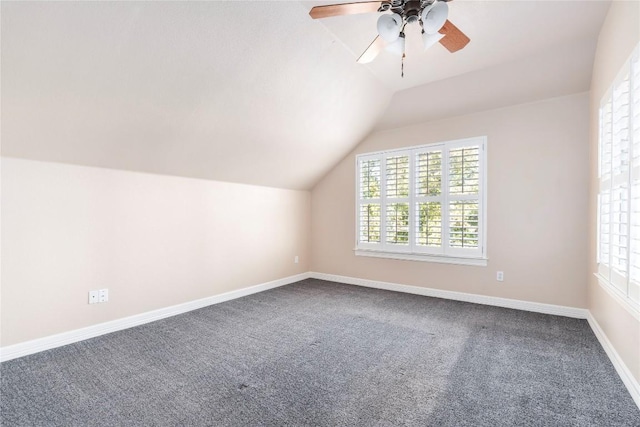 bonus room with plenty of natural light, lofted ceiling, and carpet floors