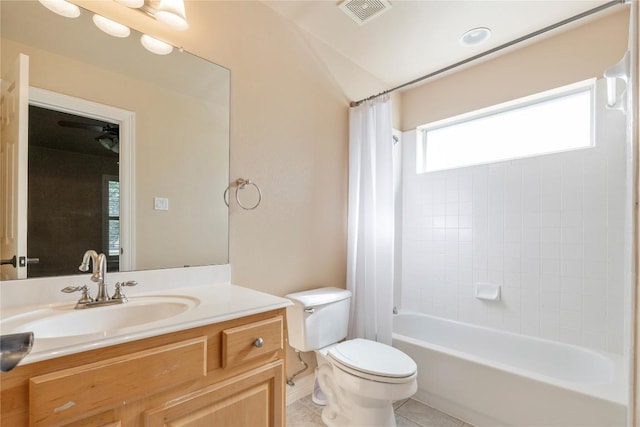 full bathroom featuring toilet, vanity, shower / tub combo with curtain, and tile patterned flooring