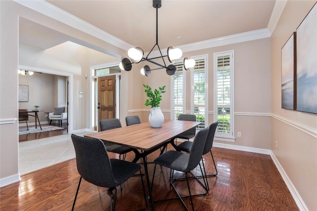 504 River Down Rd, Georgetown, TX 78628 - dining room featuring ornamental molding, wood finished floors, and a chandelier