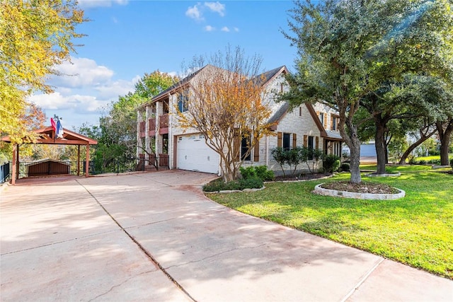 504 River Down Rd, Georgetown, TX 78628 - view of front facade featuring an attached garage, concrete driveway, and a carport