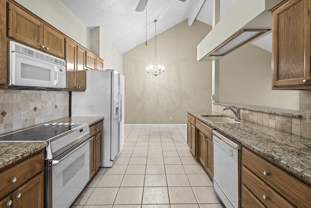 kitchen featuring white appliances, lofted ceiling with beams, ceiling fan with notable chandelier, sink, and tasteful backsplash