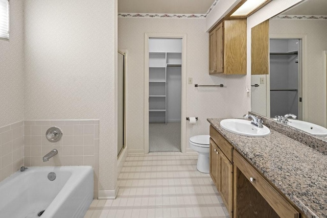 full bathroom with vanity, independent shower and bath, and toilet