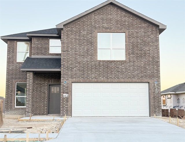 view of front of property with a garage