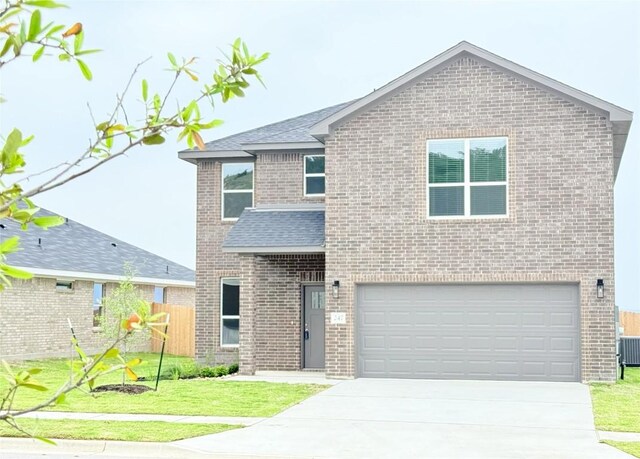 247 Fawn Ridge Dr, Copperas Cove, TX 76522 - traditional home featuring concrete driveway, brick siding, a garage, and roof with shingles