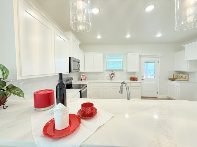 247 Fawn Ridge Dr, Copperas Cove, TX 76522 - kitchen featuring appliances with stainless steel finishes, backsplash, white cabinetry, and recessed lighting