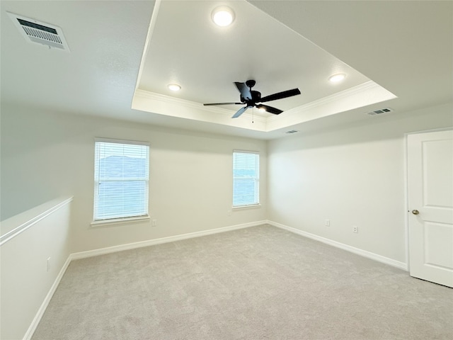 247 Fawn Ridge Dr, Copperas Cove, TX 76522 - spare room with a tray ceiling, ornamental molding, ceiling fan, light carpet, and baseboards