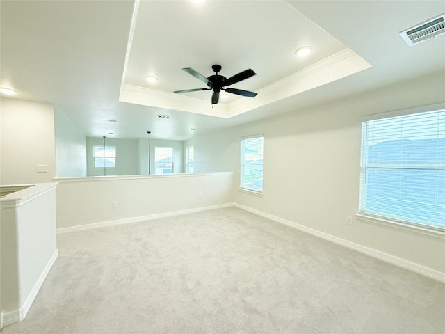 247 Fawn Ridge Dr, Copperas Cove, TX 76522 - spare room with crown molding, a raised ceiling, a ceiling fan, light carpet, and baseboards