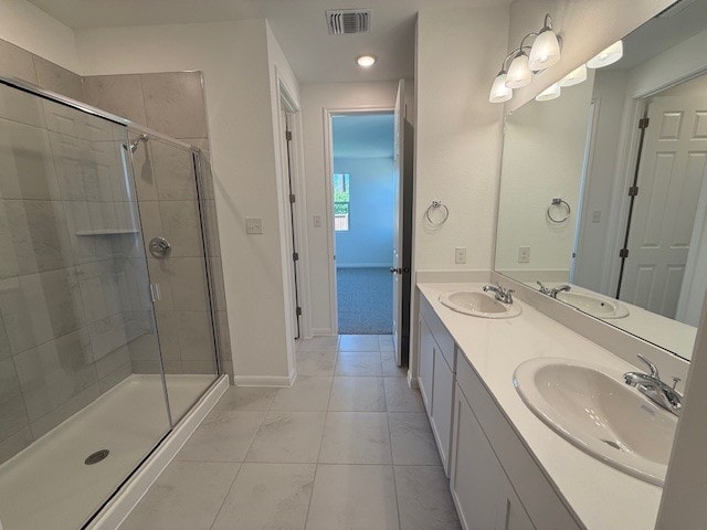 1020 Stonehill Dr, Georgetown, TX 78633 - full bathroom with baseboards, a shower stall, double vanity, tile patterned floors, and recessed lighting