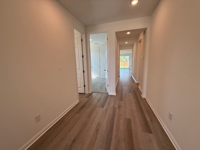 1020 Stonehill Dr, Georgetown, TX 78633 - hallway with dark wood-style flooring, baseboards, and recessed lighting