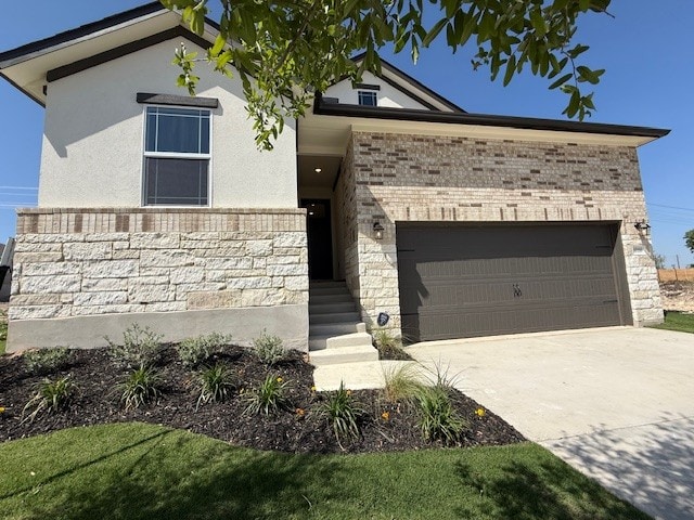 1020 Stonehill Dr, Georgetown, TX 78633 - view of front of property with a garage, driveway, stone siding, and stucco siding