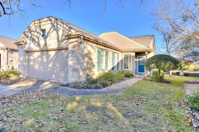 view of front of property with a garage and a front lawn