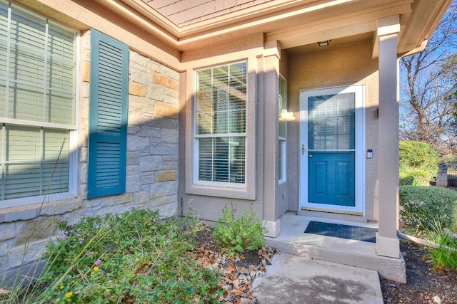 view of exterior entry with stone siding