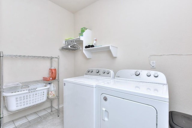 clothes washing area featuring laundry area and separate washer and dryer