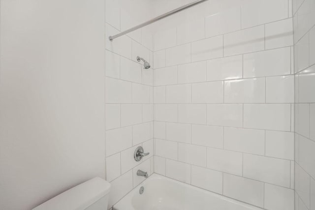 144 Adelton Blvd, Bastrop, TX 78602 - bathroom featuring toilet and shower / tub combination
