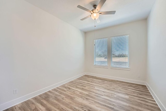 144 Adelton Blvd, Bastrop, TX 78602 - unfurnished room with light wood finished floors, baseboards, and ceiling fan