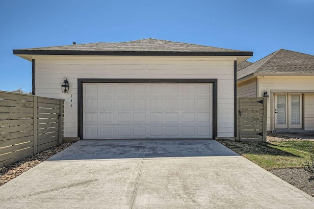 144 Adelton Blvd, Bastrop, TX 78602 - garage featuring concrete driveway
