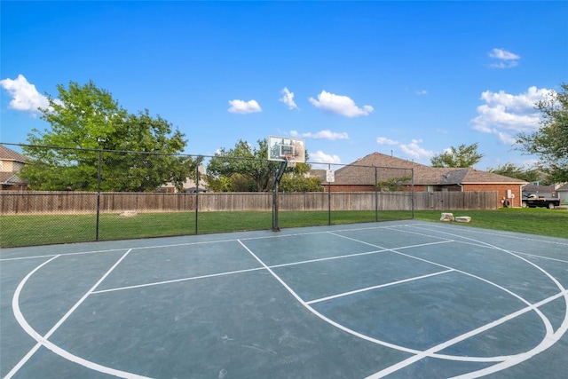 view of basketball court featuring a lawn