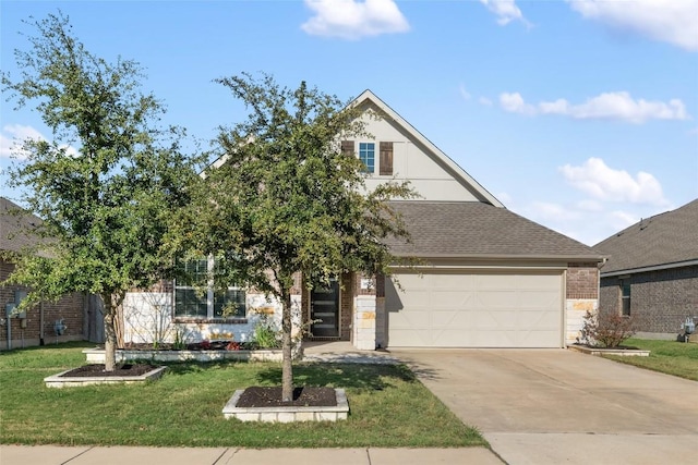 view of front of home with a garage and a front lawn